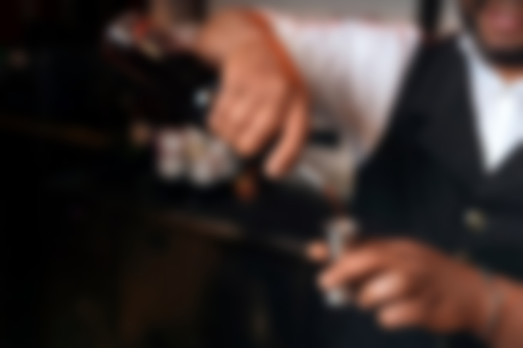 bartender-preparing-drink-bar_23-2150444003