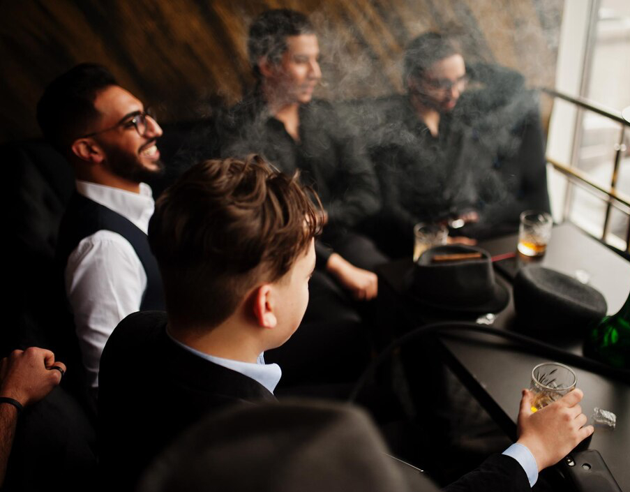 group-handsome-retro-welldressed-man-gangsters-spend-time-club-smoking-hookah-multiethnic-male-bachelor-mafia-party-restaurant_627829-12017
